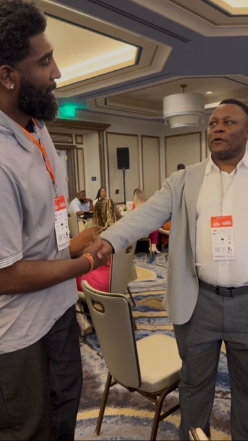 Derrick w NFL Hall of Famer Barry Sanders