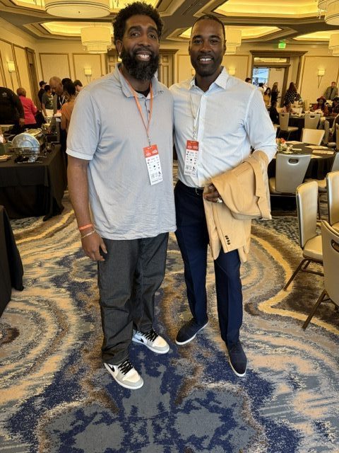 Derrick w NFL Hall of Famer Calvin Johnson